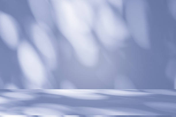 istock Studio style background wall decoration presentation uses white and blue tones. with shadows cast from a nearby window, concept creating a decorative 2242129606