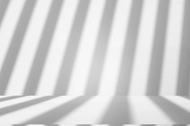 istock Wall interior background, studio and backdrops show products.with shadow from window color white . background for text insertion and presentation product 2242129786