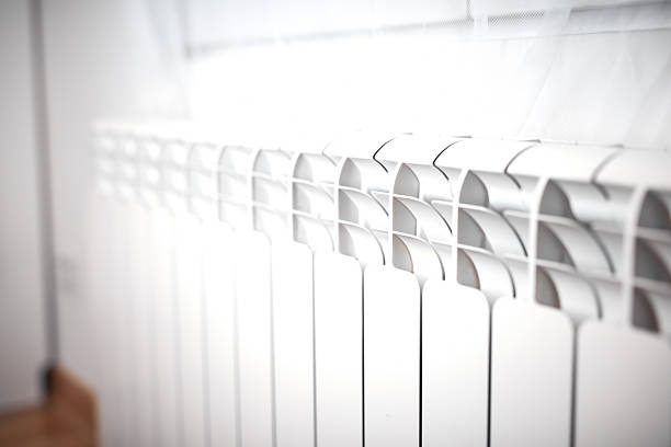 Heating radiator on a chilly winter day, energy and gas crisis, cold room, heating problems.
