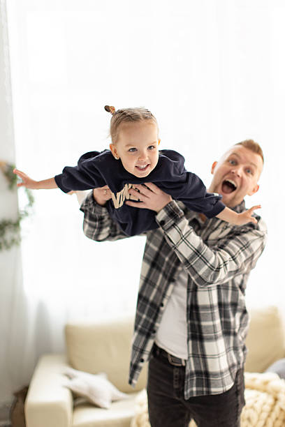 istock Father and Daughter Playing 2242132234