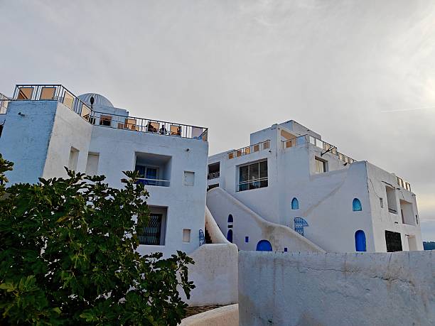 istock Terraced Hotel Wings with Guests Under Soft Sunlight 2242134506