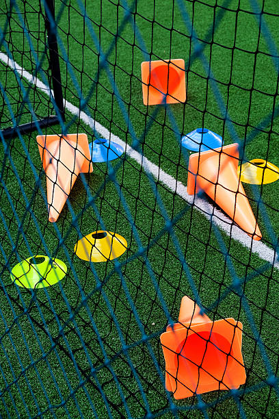 istock Soccer goal and cones on green artificial turf 2242135551