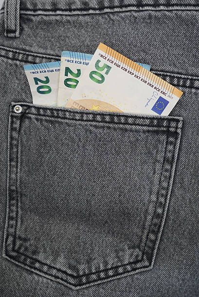 istock Euro banknotes in a jeans pocket 2242136868