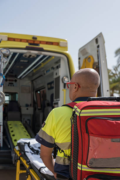 istock Paramedic is preparing to assist someone on a tropical beach 2242138013