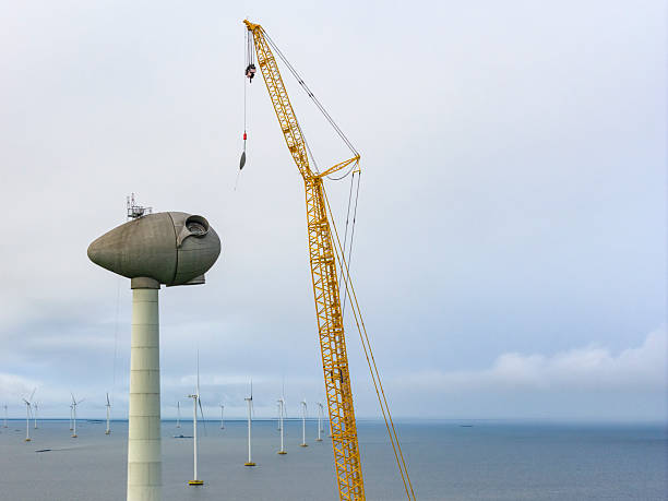Wind turbine construction with huge cranes at a wind farm in Flevoland, Netherlands.