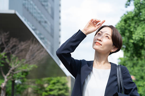 A middle-aged businesswoman working in an office district