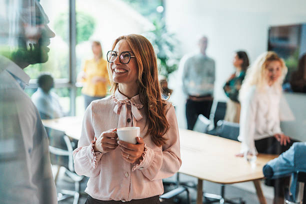 istock Business colleagues talking in the office 2242142575