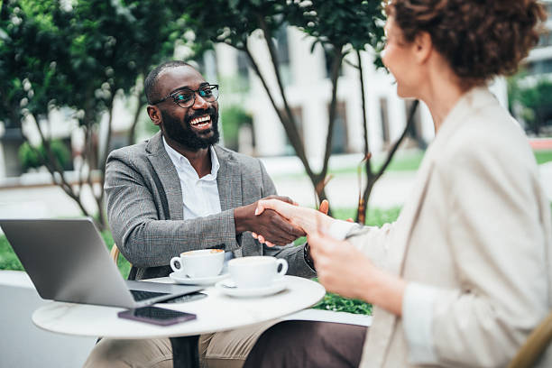 istock Successful business agreement sealed with a handshake in cafe 2242142593