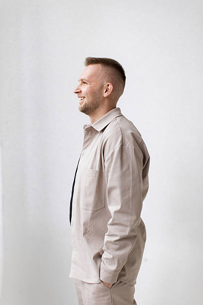 istock Smiling Man in Beige Outfit 2242144706