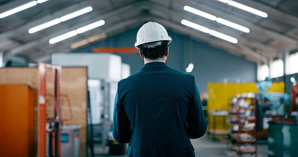 istock Back, businessman or boss in warehouse for manufacturing solution, quality control or safety compliance. Production, manager and person in factory for development plan, supply chain and supervision. 2242145821