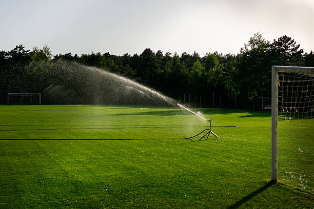 istock Sprinklers on a soccer field 2242146777
