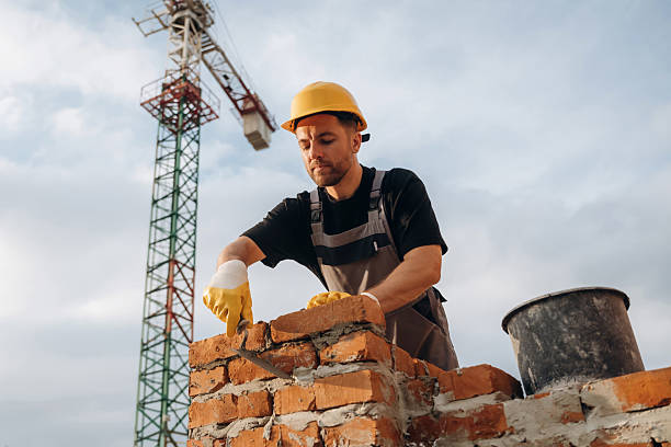 istock Busy, against the crane in distance. A builder is working at the construction site at daytime 2242147623