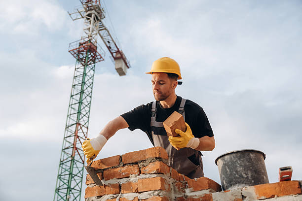 istock Busy, against the crane in distance. A builder is working at the construction site at daytime 2242147650