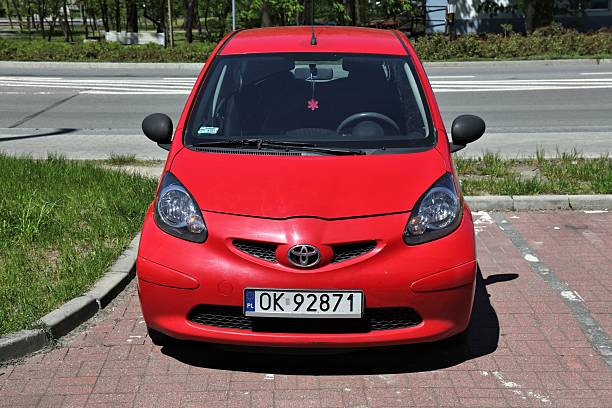 Compact car isolated in white background. The abstract car has no real prototype