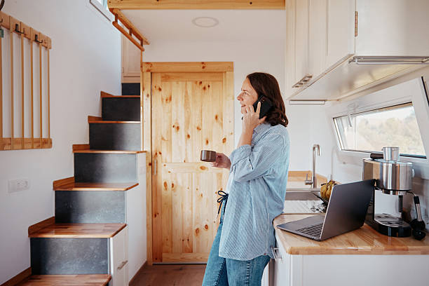 istock Morning phone call in a tiny house kitchen 2242155750
