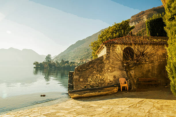 Public Yard with boat in Sala Comacina on lake Como  - saunny day - I travel Chinese tourist - hiking along coastline