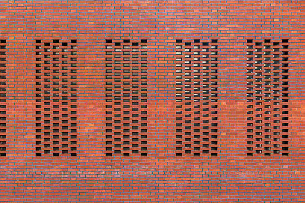 Texture and geometric patterns of red brick building parts