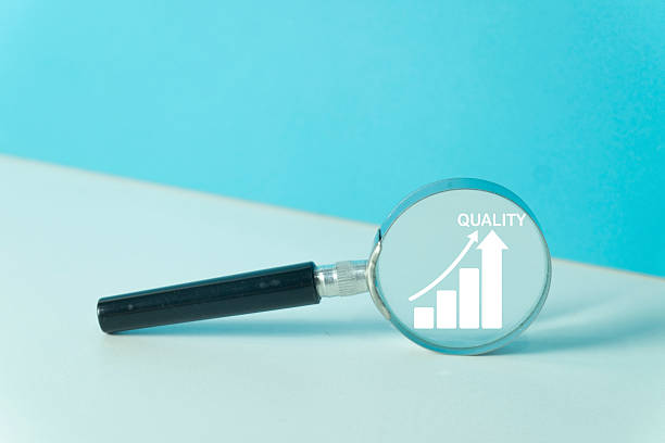 Business growth,Quality improvement concept.,A magnifying glass focuses on a growth bar chart with an arrow and the word Quality, symbolizing continuous improvement,business strategy and development.