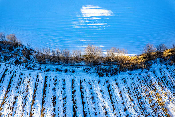 Aerial view of light and shadow textures created by sunlight shining on the snow