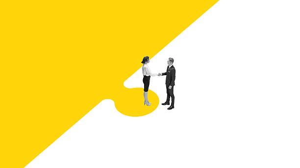 istock Graphic artwork. Business partners shaking hands standing on yellow puzzle background 2242162010