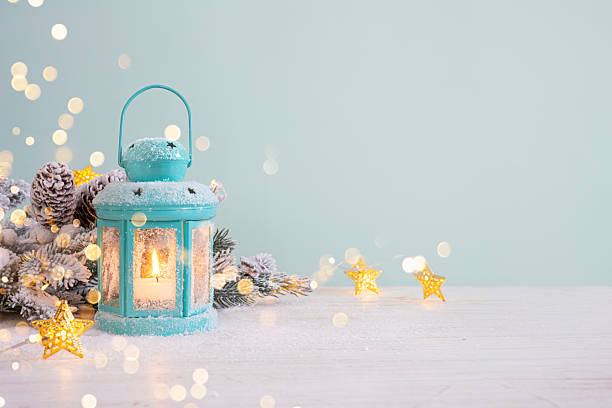 istock Christmas lantern on snowy table with fir branches and decoration ornaments 2242162203