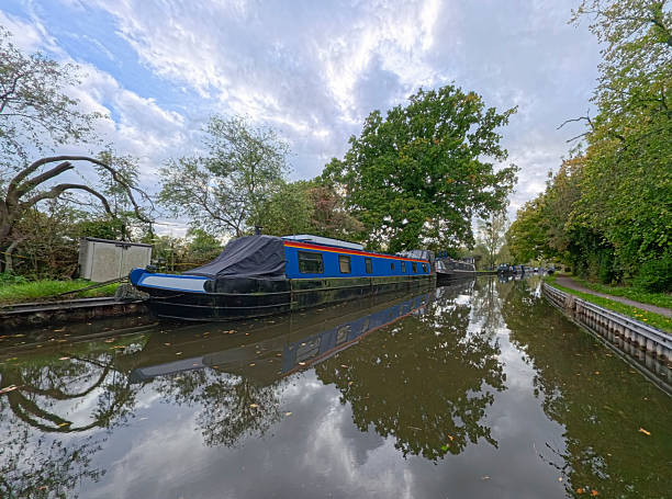 istock Narrowboats moored on a British canal in rural setting 2242162645