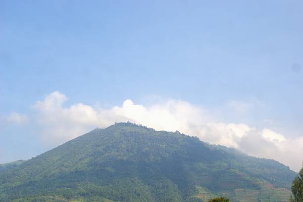 istock Tropical mountain landscape with clouds 2242165515
