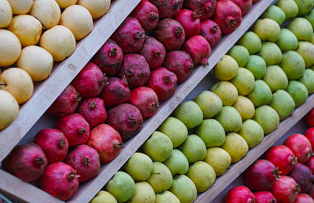 They picked apples, pomegranates, and pears at the store counter