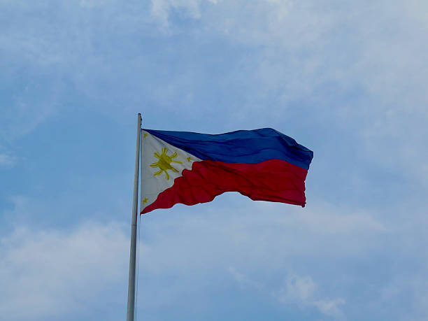 istock The Philippine flag waves proudly against a bright blue sky. 2242167241