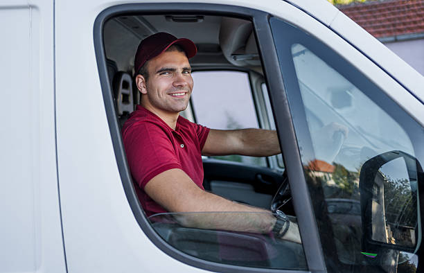 istock Young adult man driver delivering parcel with a van 2242167773