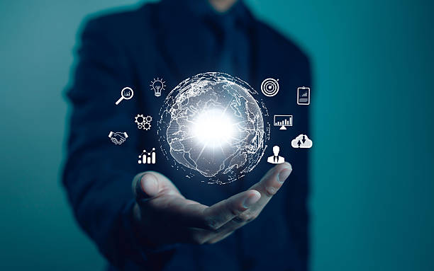 istock A businessman holds a digital globe with data connection network icons. Developing the evolving intelligence and global business development, applying digital technology and artificial intelligence. 2242169560