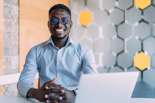 istock Successful businessman in modern office working on laptop. 2242169765