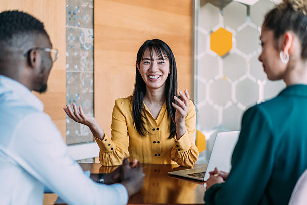 istock Group of business persons talking in the office. 2242169781