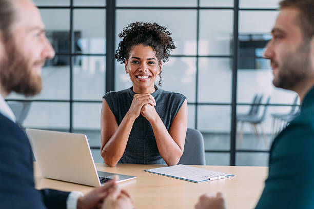 istock Group of business persons talking in the office. 2242170939