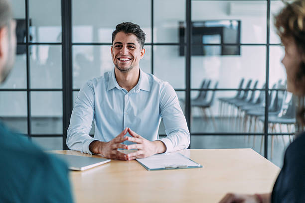 istock Group of business persons talking in the office. 2242170945