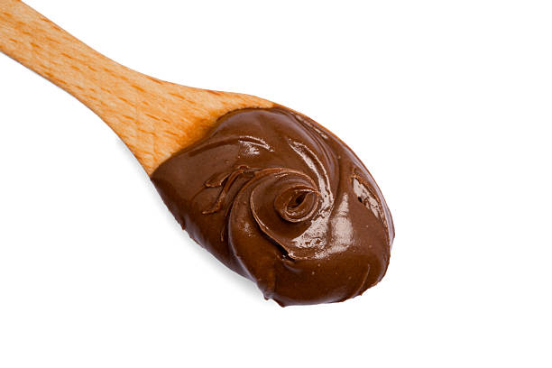 istock Cream chocolate with spoon on a white background 2242174031