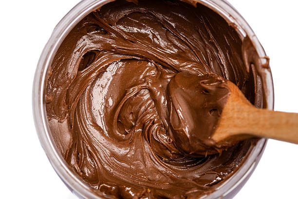 istock Cream chocolate with spoon on a white background 2242174048