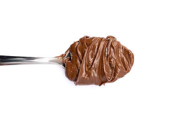 istock Cream chocolate with spoon on a white background 2242174087