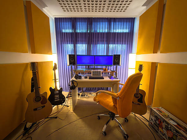 istock Professional recording setup with guitars and studio monitors on a desk 2242174567
