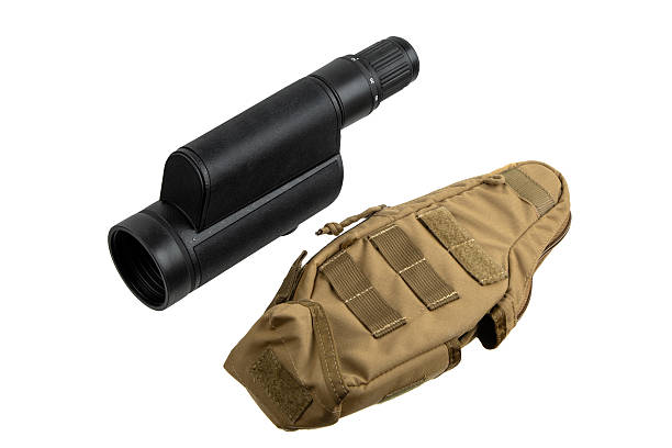 A black monocular and its tan tactical storage pouch.