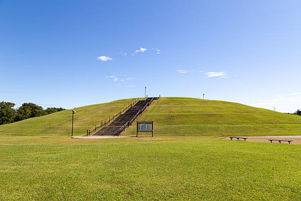 istock Tsunami evacuation mound and grassy area 2242180048