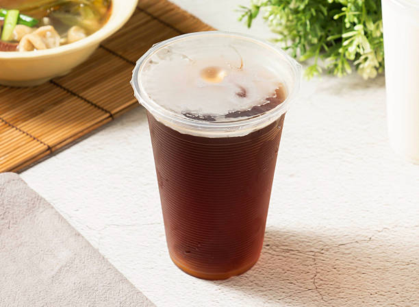 istock Iced black tea refreshment for a hot day, cool down with this delicious drink, a sweet escape in a cup, served in takeaway cup, perfect for summer 2242184086