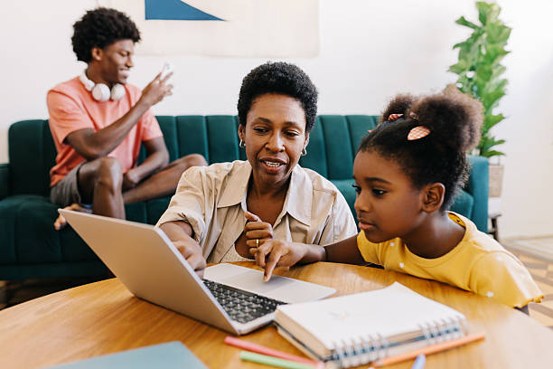 istock Mom homeshooling her daughter with a laptop 2242184194