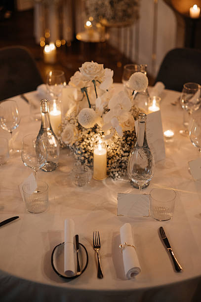istock Elegant Wedding Table Setting with Candles and Flowers 2242184384
