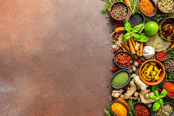istock A diverse collection of vibrant spices and herbs, elegantly positioned on a brown backdrop, exuding natural beauty and a burst of fragrances 2242185089