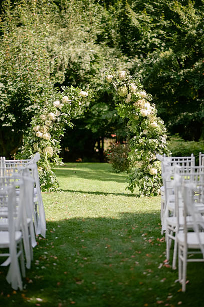 istock Outdoor Wedding Ceremony with Floral Arch 2242190301