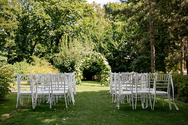 istock Outdoor Wedding Ceremony with Floral Arch 2242190346