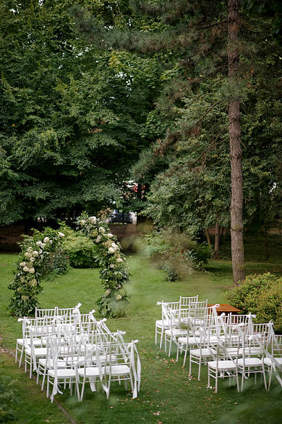 istock Outdoor Wedding Ceremony with Floral Arch 2242190453