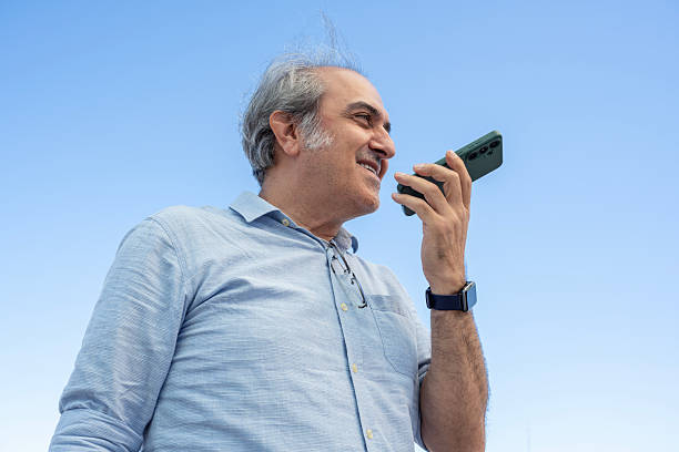 Good looking man using smartphone on the street