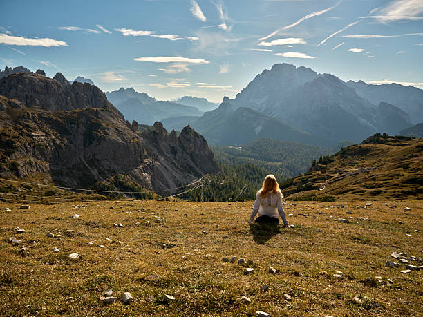 istock Woman enjoying solitude in Dolomites mountain landscape 2242191704